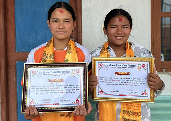 photo of Anita Tamang and Munu Tamang with their awards