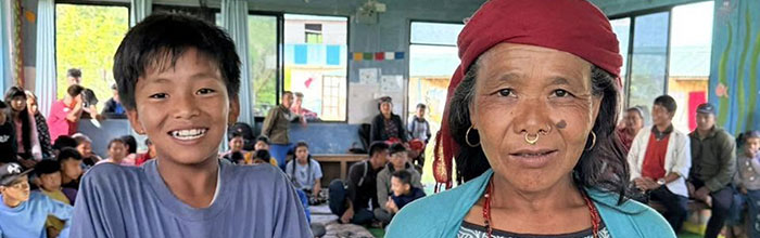 photo of mother and son receiving text books